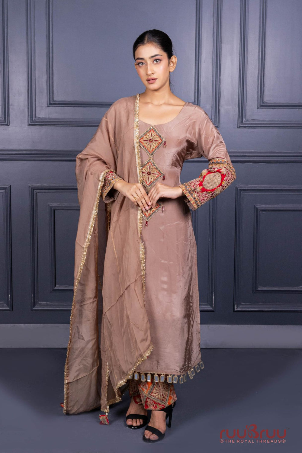 Designer Occasion Wear Pure Silk Shimmer Ladies Suit with Heavy Embroidery on Bottom.