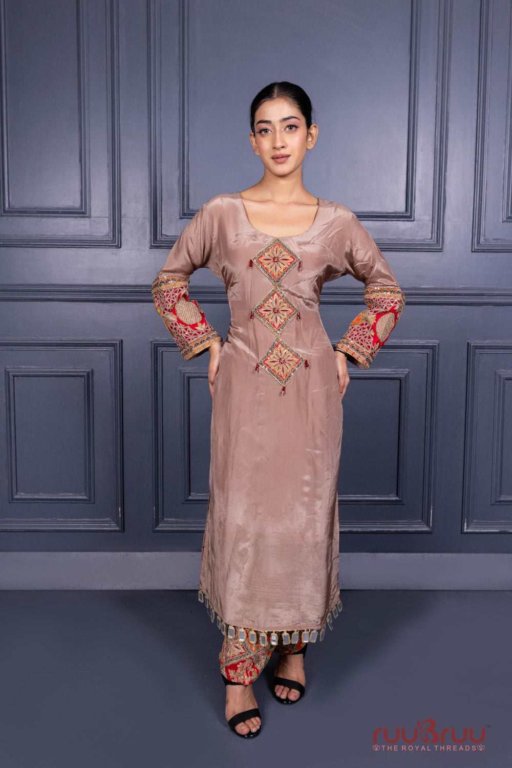 Designer Occasion Wear Pure Silk Shimmer Ladies Suit with Heavy Embroidery on Bottom.