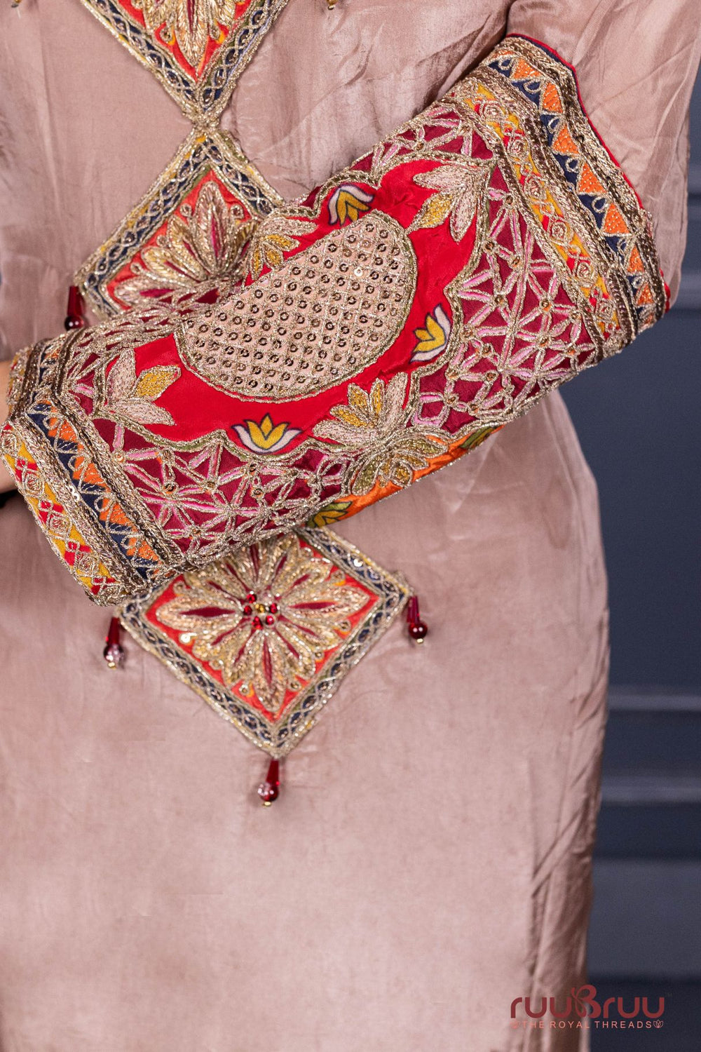 Designer Occasion Wear Pure Silk Shimmer Ladies Suit with Heavy Embroidery on Bottom.