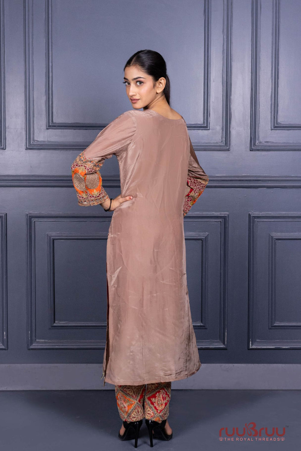 Designer Occasion Wear Pure Silk Shimmer Ladies Suit with Heavy Embroidery on Bottom.