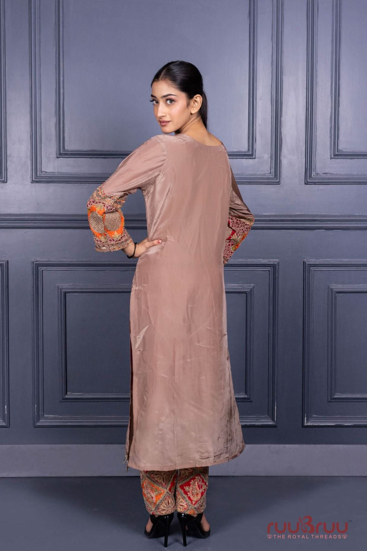 Designer Occasion Wear Pure Silk Shimmer Ladies Suit with Heavy Embroidery on Bottom.