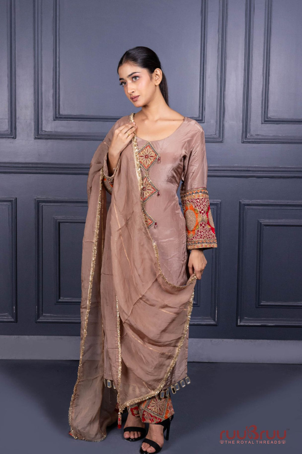 Designer Occasion Wear Pure Silk Shimmer Ladies Suit with Heavy Embroidery on Bottom.