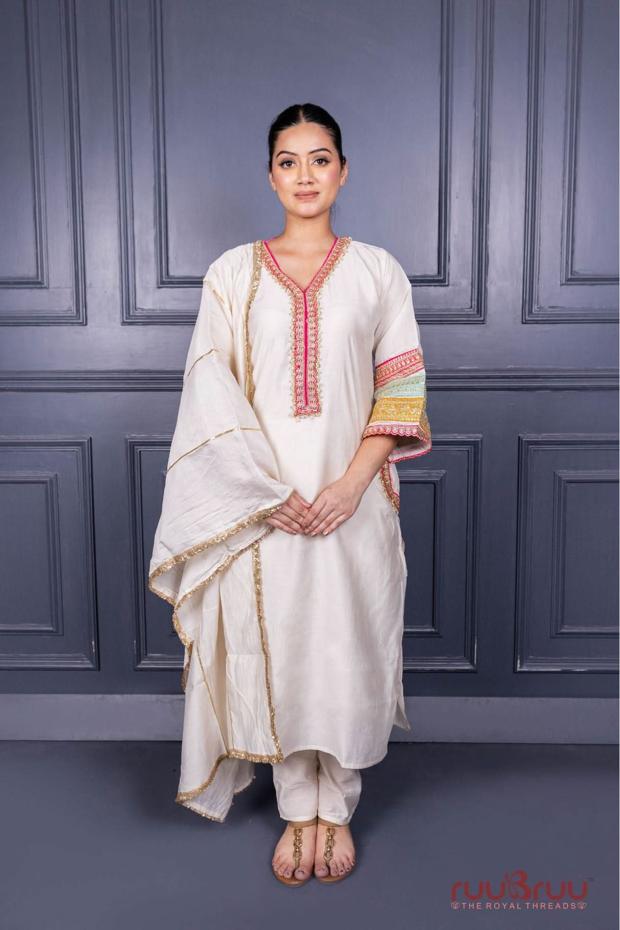 Designer Occasion Wear Viscose Silk Ladies Suit with Heavy Embroidery on Neck, Sleeves & Pockets.