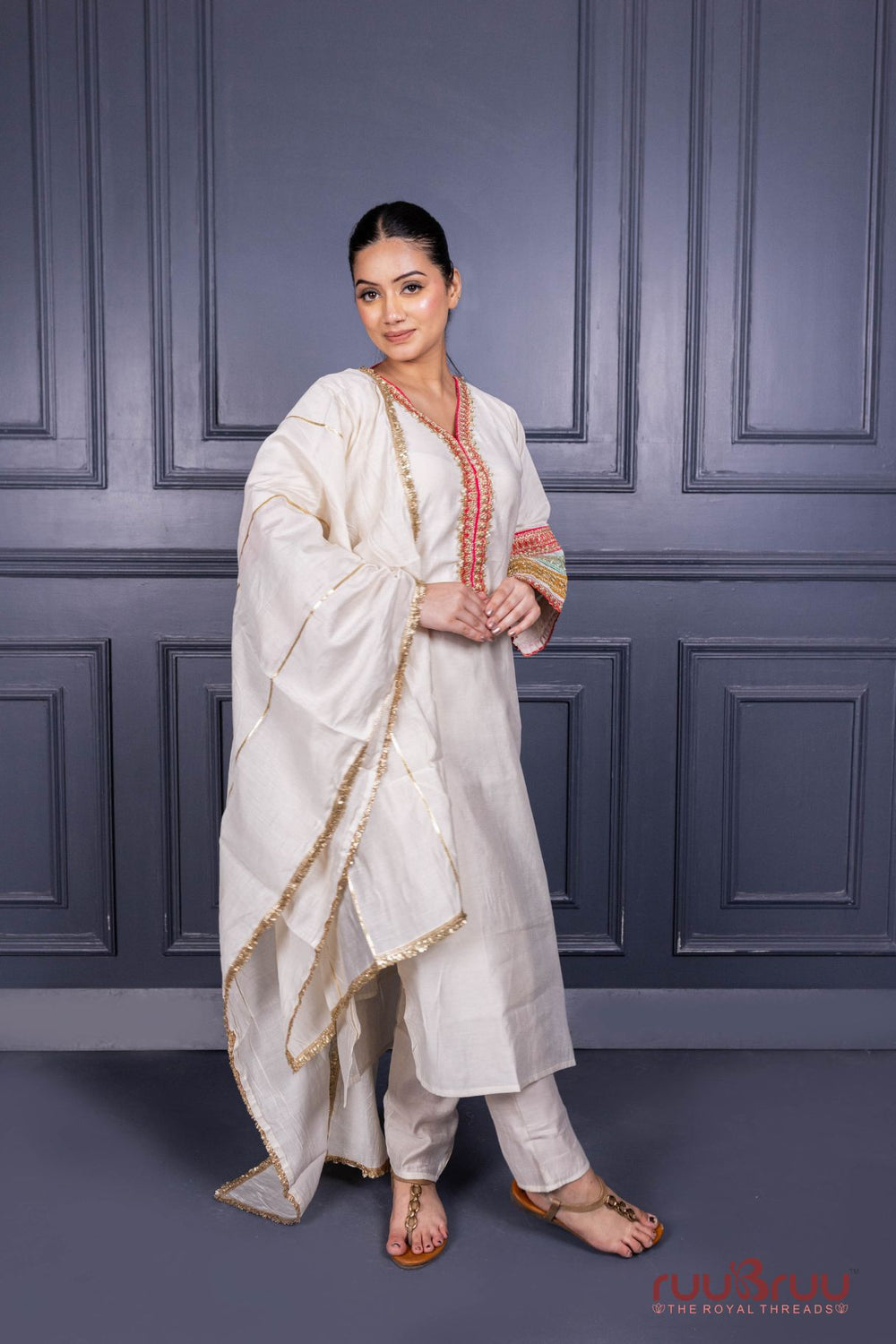 Designer Occasion Wear Viscose Silk Ladies Suit with Heavy Embroidery on Neck, Sleeves & Pockets.