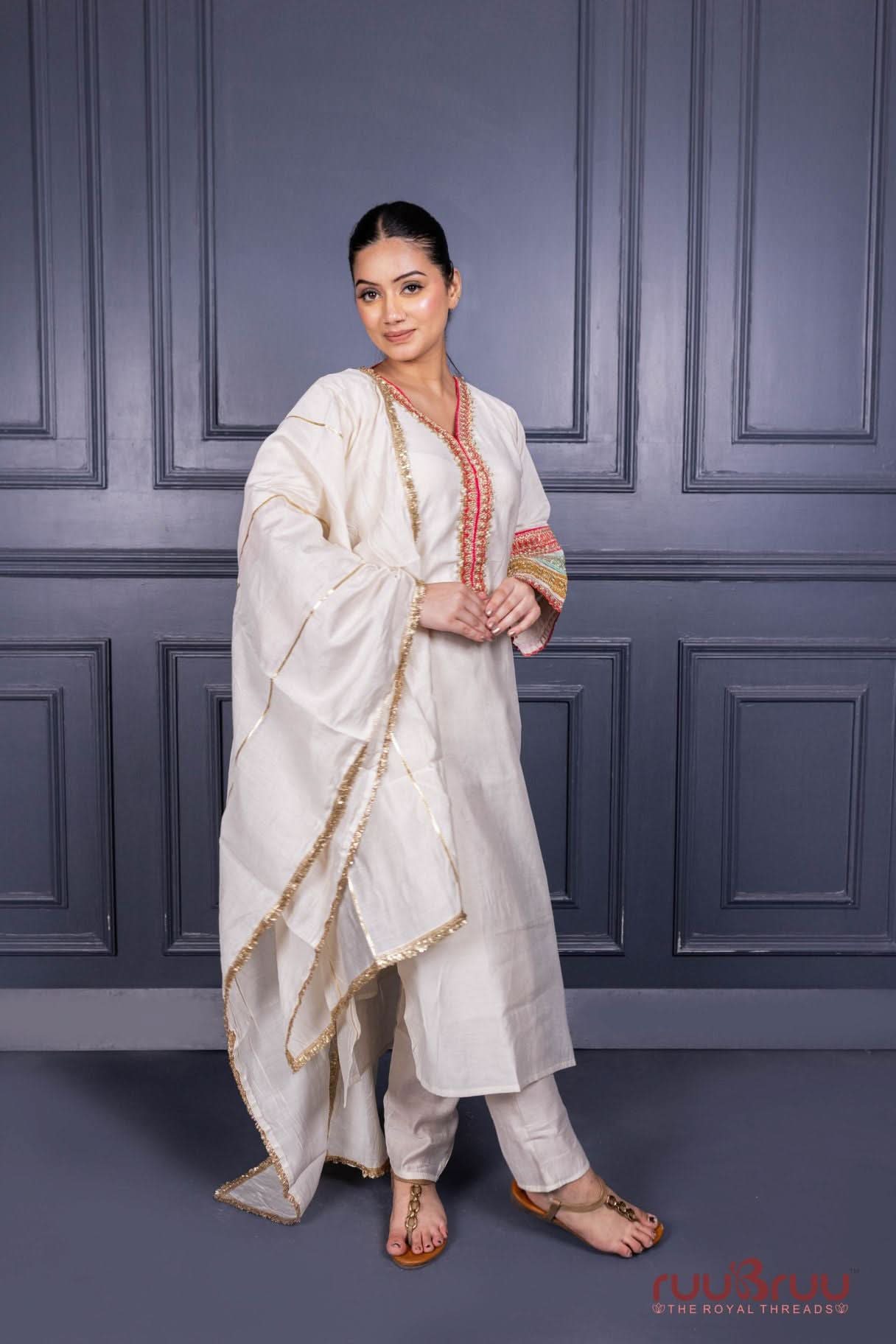 Designer Occasion Wear Viscose Silk Ladies Suit with Heavy Embroidery on Neck, Sleeves & Pockets.