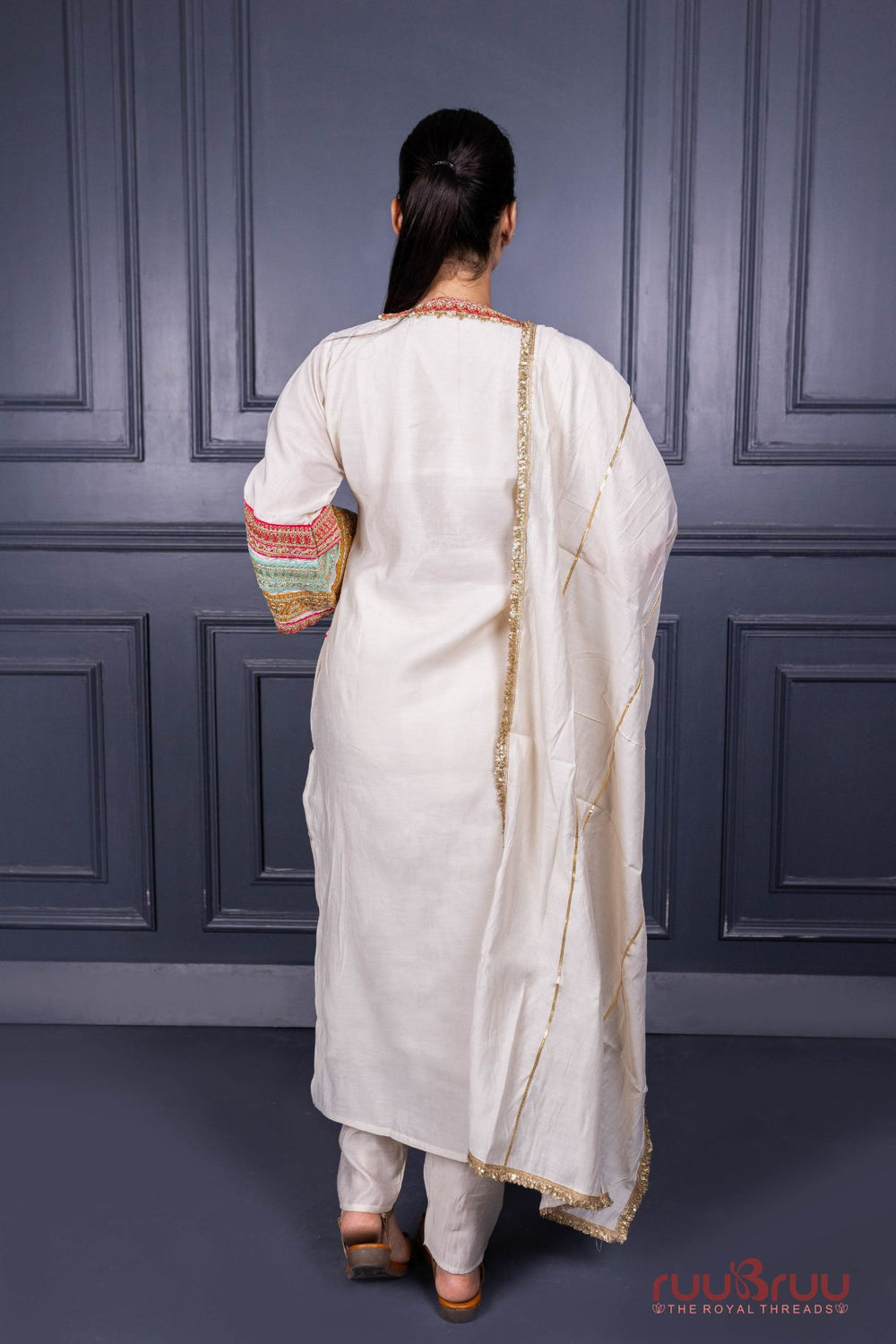 Designer Occasion Wear Viscose Silk Ladies Suit with Heavy Embroidery on Neck, Sleeves & Pockets.