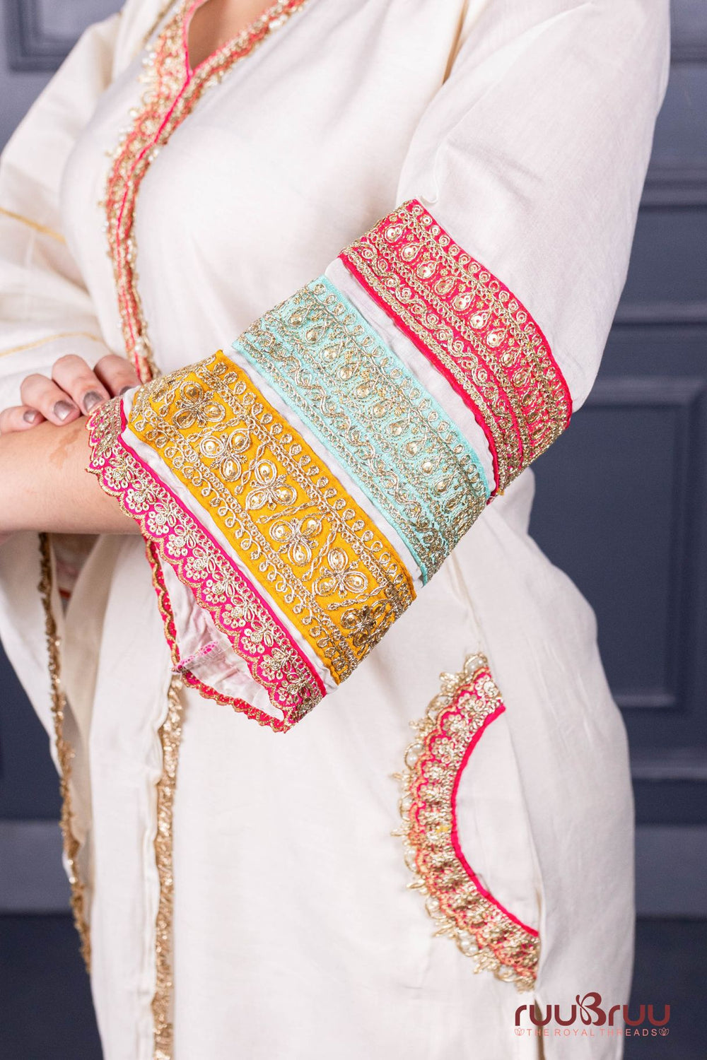 Designer Occasion Wear Viscose Silk Ladies Suit with Heavy Embroidery on Neck, Sleeves & Pockets.
