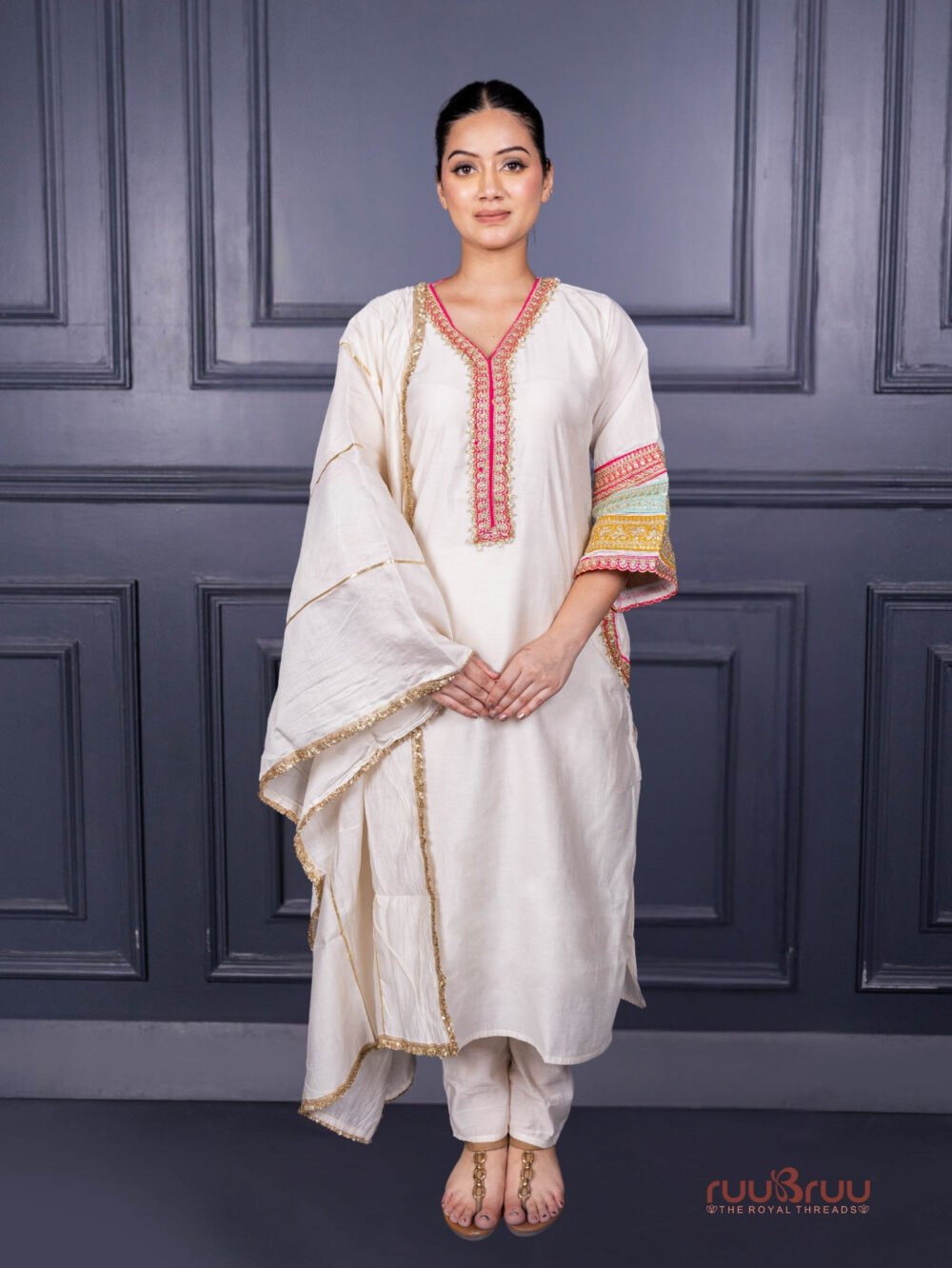Designer Occasion Wear Viscose Silk Ladies Suit with Heavy Embroidery on Neck, Sleeves & Pockets.